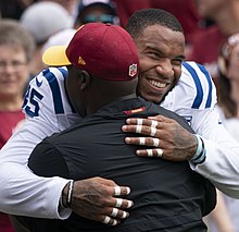 Ebron hugging former North Carolina assistant coach Randy Jordan in 2018 Eric Ebron (42916727860).jpg