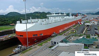 A Panamax ship in transit through the Miraflores locks, Panama Canal Exclusa Miraflores Canal de Panama Panorama.jpg