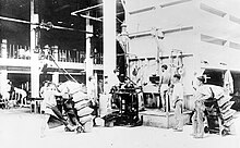 Asian plantation workers filling bags of sugar during the 1910s. Filling sugar sacks, Hawaii.jpg.jpg