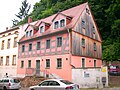 Residential house in half-open development (with staircase on the street)