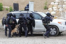 Assault team with attack dog and Centigon Armoured SUV