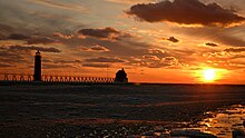 The Grand Haven fog signal and inner lighthouse in February 2006. Grand haven lighthouse.jpg