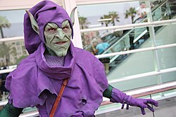A fan dressed in Green Goblin cosplay.