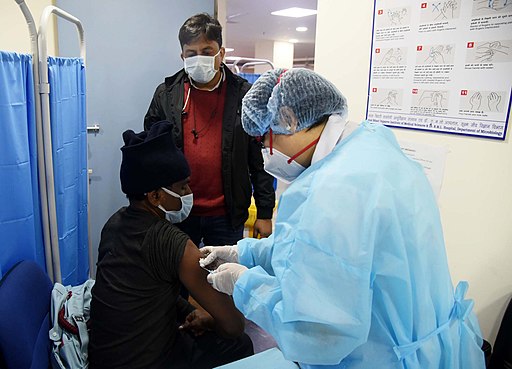 Health care workers administering covid-19 vaccination in New Delhi on 16 January 2021