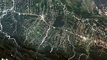 Satellite view of coca leaf and tropical fruit plantations in the Ivirgazama region of Bolivia. Several tropical areas in the country have experienced major deforestation. Ivirgarzama, Bolivia's Puerto Villarroel county.jpg