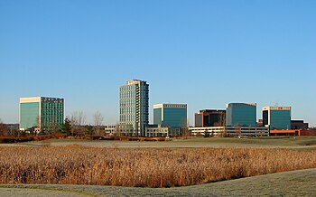 Skyline of KRP Properties and Brookstreet Hotel with Marshes Golf Club in foreground Kanata Research Park.JPG