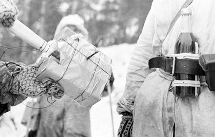 Finnish soldiers in the Winter War. Tanks were destroyed with satchel charges and Molotov cocktails. The bottle has storm matches instead of a rag for a fuse.