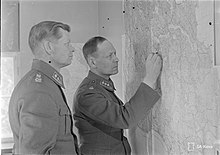 Lieutenant colonels Mäkinen and Hämäläinen inspecting a map.jpg