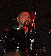 Drummer Masayuki Suzuki replaced Higuchi in 2009. Loudness 2010 02.jpg