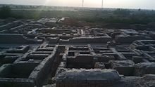 Regularity of streets and buildings suggests the influence of ancient urban planning in Mohenjo-daro's construction. Moen Jo Daro (The Mond of the Deads).jpg