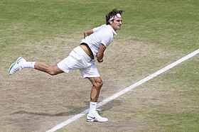Federer serving in the Wimbledon quarterfinals. Roger Federer serve in Wimbledon 2012.jpg
