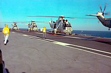 RAN Sea King Mk50s of HS-817 Squadron preparing to launch from HMAS Melbourne Sea Kings on deck HMAS Melbourne 1980.jpg