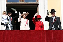 In Oslo, the children's parade ends in the palace gardens of the Royal Palace with the Norwegian royal family present on the balcony. 2006 The Norwegian Royal Family in 2007.jpg