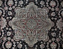 A toranj medallion, a common design in Persian carpets Toranj - special circular design of Iranian carpets.JPG