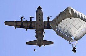 Parachutists jumping from an MC-130 using the T-11 Personnel Parachute System Truppenfallschirm T-11 unter MC-130.jpg