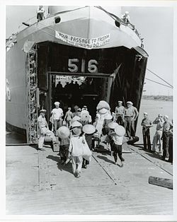 LST-516 embarking Vietnamese refugees for their journey from Haiphong, North Vietnam to Saigon, South Vietnam during Operation Passage to Freedom, October 1954. US Navy 030630-N-0000X-001 Vietnamese refugees board LST 516 for their journey from Haiphong, North Vietnam, to Saigon, South Vietnam during Operation Passage to Freedom, October 1954.jpg