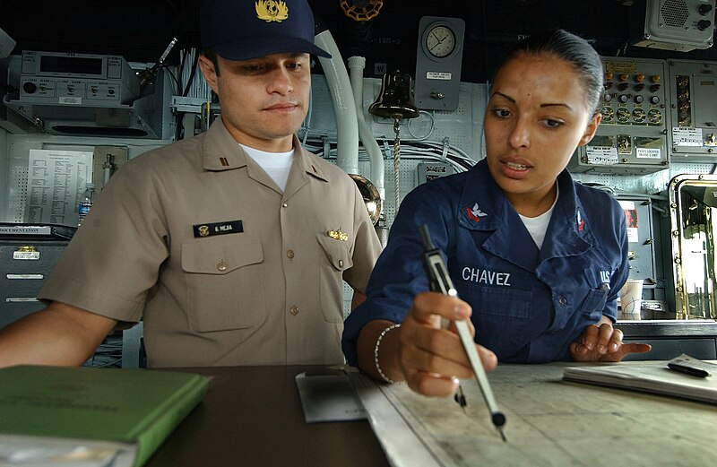 File:US Navy 050811-F-4883S-071 Peruvian Navy Lt.j.g. Gustavo Mejia, from the Peruvian frigate BAP Villavicencio (FM 52), listens as U.S. Navy Quartermaster 2nd Class Aurora Chavez explains the position of the guided missile cruiser.jpg