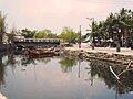 Newly constructed concrete bridge crossing Munting Ilog