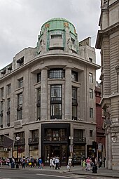 Art Deco reinterpretation of the Doric columns, with no flutings and with little or no entasis, on the Westmorland House (Regent Street no. 117-131), London, by Burnet & Tait, 1920-1925[31]
