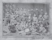 Young Jugashvili (in the middle of the standing row) in a group photograph with his classmates, c. 1892 18920000-gori-church-school-students-and-teachers-including-stalin.jpg