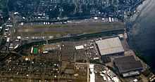 Aerial view showing airport and adjacent Boeing Renton Factory (large structures) 2009-0603-14a-Air-RentonAirBoeing.jpg