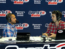 Shaun Bijani (left) and Paul Gallant airing live from a sports collectors show in Houston. 610 Sports Radio Houston Jan 2014.jpg