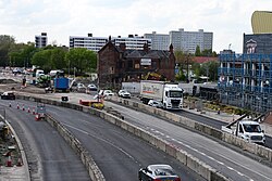 A view of the westbound side of the A63 in Kingston upon Hull, as photographed from Murdoch's Connection. A thin temporary eastbound lane (the lighter lane) is now out of use for civilian traffic as the work continues.