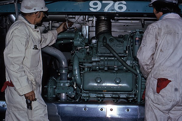 AC Transit mechanics examine the 6V71 engine of bus no. 976