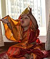 A baby girl dressed up like Godess Durga in Navratri