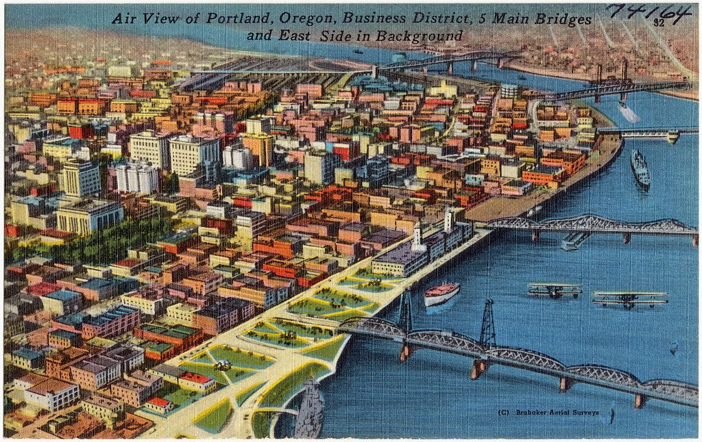 Air view of Portland, Oregon, Business District, 5 main bridges and east side in background (74164)