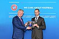 Akhmetov received award from the UEFA president Aleksander Čeferin 12-2021.jpg