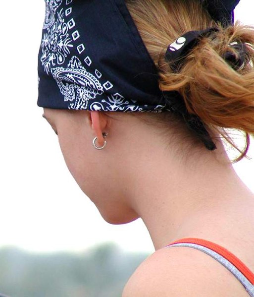 A woman wearing a black bandana on her head