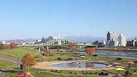 Asahibashi Bridge and Mt. Daisetsuzan Range.jpg