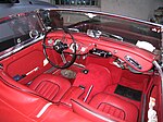 The red leather cockpit of an Austin-Healy 3000, a sports car.