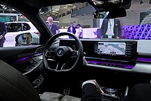 Interior with the updated iDrive 8.5 infotainment system and the BMW Interaction Bar. BMW i5 IAA 2023 1X7A0106.jpg