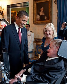 Lucy and Stephen Hawking with U.S. president Barack Obama in the Blue Room of the White House in 2009 Barack Obama speaks to Stephen Hawking (cropped).jpg