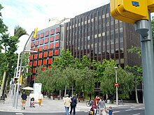 Building with red window panels (17921963904).jpg