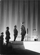 Adolf Hitler at the Nuremberg Rally in 1936 Bundesarchiv Bild 183-2006-0329-502, Nurnberg, Reichsparteitag, Adolf Hitler vor Lichtdom.jpg