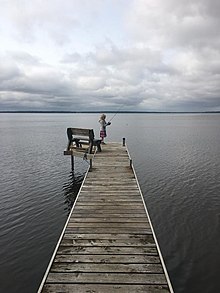 Girl fishing from privately owned dock