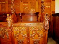 Carving on choir stall.Church of Holy Spirit, Clapham, courtesy Rev. Jeremy Blunden.