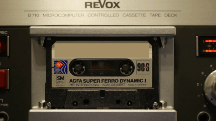 A cassette tape rotating in a cassette deck