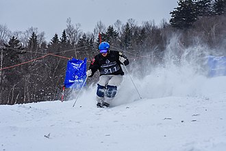 An athlete mogul skiing at Waterville Valley Resort Competitive mogul skiing.jpg