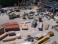 Construction equipment and pieces lying around.