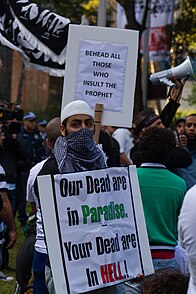 Protestors holding signs as a response to Innocence of Muslims Criticism of Islam.jpg