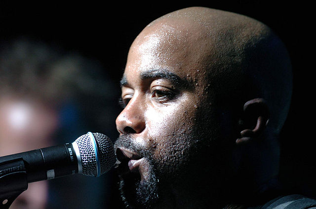 Rucker sings to a crowd during an Operation Pacific Greetings tour concert.