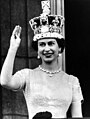 Elizabeth II waves from the palace balcony after the Coronation, 1953.jpg