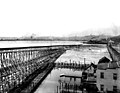 The South Canal trestle and Grant St Bridge (shown here in 1901; view from the south) ran north-south near the foot of Beacon Hill, in what would soon be filled in and become the Industrial District