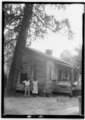 FRONT (NORTH) AND EAST SIDE OF SERVANT HOME, REAR OF MAIN HOUSE - Perkins-Spencer House, Spencer Street, Eutaw, Greene County, HABS ALA,32-EUTA,3-6.tif
