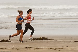 Female joggers on foggy Morro Strand State Beach.jpg