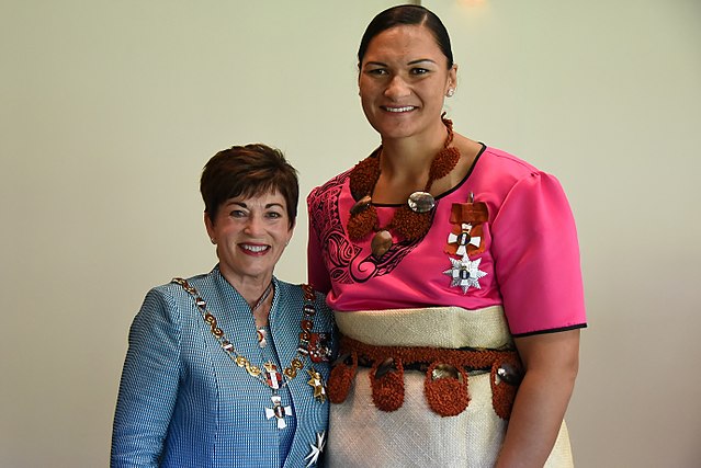 Adams (right) in 2017, after her investiture as a Dame Companion of the New Zealand Order of Merit by the Governor-General, Dame Patsy Reddy